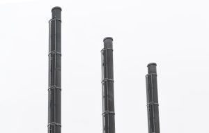 three black steel industrial chiminea